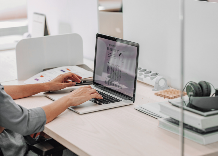 Fund manager analyzing data on his laptop - Strathsquare Point